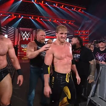 The heel WarGames team, featuring muscular wrestlers, gathers backstage with an intense focus before their Survivor Series match on WWE Raw.