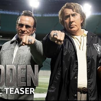 A scene from the teaser for 'Madden' featuring two male characters posing on a football field, one holding a football and both showing off their championship rings, with the title 'MADDEN OFFICIAL TEASER' at the bottom.