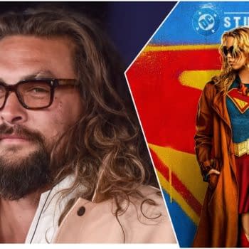 The image features a split view, with a close-up of a man with long, curly hair and glasses on the left, and a portrayal of a female superhero dressed as Supergirl on the right, wearing a blue costume with a red cape and a brown coat. The background displays vibrant colors with the DC Studios logo.
