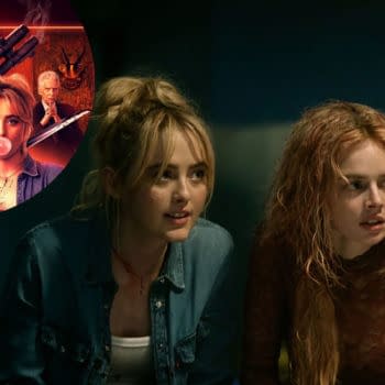 A scene from the movie 'Ready Or Not 2' featuring Kathryn Newton and Samara Weaving, both capturing dramatic expressions as they appear engaged and tense. The background hints at a suspenseful atmosphere.