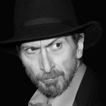 Frank Miller at the Los Angeles premiere of "300"., wearing a black hat and a collared shirt. The image captures the essence of a celebrity moment at the premiere of '300' in Hollywood.