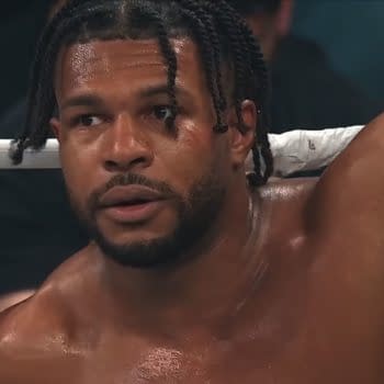 Kevin Knights leans against the ropes in the AEW ring, looking winded and concerned after MJF’s latest outburst on Dynamite.