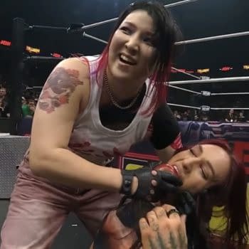 Hikaru Shida offers Kris Statlander a snack while the two wrestle ringside during an AEW Lights Out match in Philadelphia.