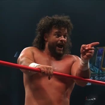 Juice Robinson points emphatically from inside the AEW ring during Collision, with a Double or Nothing sign in the background.