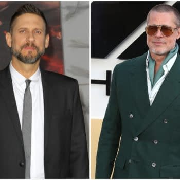 Side-by-side portrait of filmmaker David Ayer and actor Brad Pitt at a red-carpet event. Ayer wears a black suit and tie, while Pitt wears sunglasses and a dark green suit.