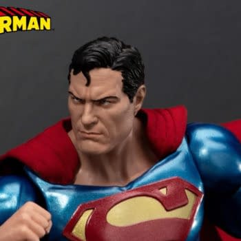 Superman collectible figure in a dramatic pose, wearing a blue suit with a red cape and a Beast Kingdom Exclusive 2026 badge in the corner.