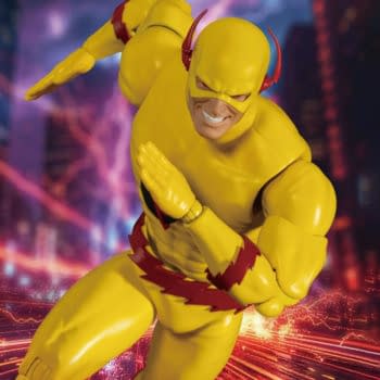 A Beast Kingdom comic figure of the Reverse-Flash in a running pose, shown against a streaked, lightning-filled background. The character wears a bright yellow suit with red lightning details.
