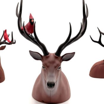 Three views of a deer-shaped card dispenser or popcorn bucket with large antlers and a red cardinal perched on top, shown on a white background.