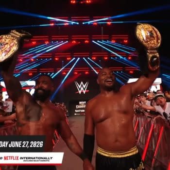 The Street Profits walk the WWE Raw entrance ramp in London, raising gold championship belts above a cheering crowd. Red and blue stage lights glow behind them.