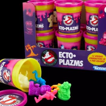 Hasbro The Real Ghostbusters Ecto-Plazms toys in colorful pink-and-purple canisters, with several small neon figures spilled out in front. The packaging shows the Ghostbusters logo and a 4+ age mark.