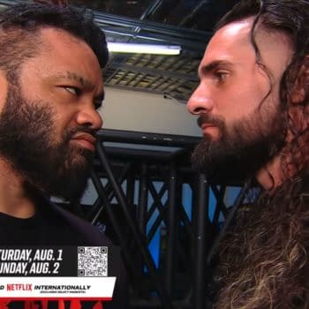 Jacob Fatu and Seth Rollins stare each other down backstage on WWE Raw, locked in a tense face-to-face confrontation.