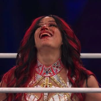 Mercedes Moné smiles in the wrestling ring with blood on her face at AEW All In London.