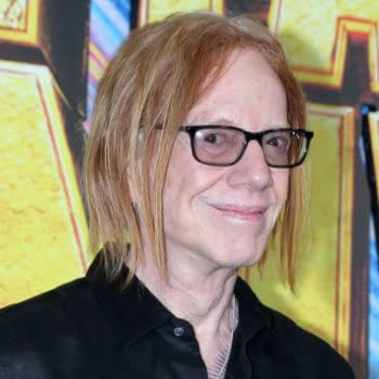 Danny Elfman poses on the red carpet at the Stuart Fails To Save The Universe series premiere in Los Angeles, wearing glasses and a black shirt.