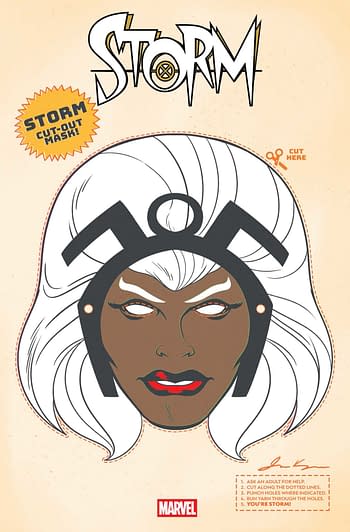A retro-style cut-out mask featuring the character Storm from Marvel Comics. The mask has distinct facial features, light-colored hair, and instructions for cutting and using it.