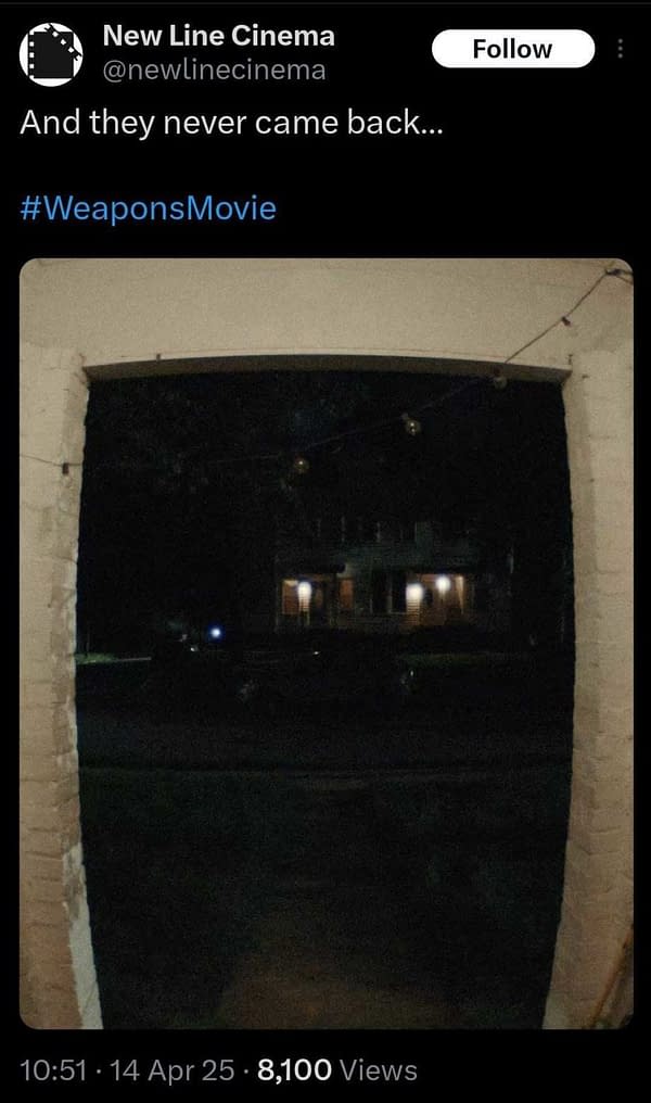 A dimly lit view from a porch looking out onto a dark street, with a few houses visible in the background. Decorative lights hang along the porch, creating a subtle ambiance.