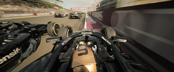 A dynamic close-up shot of Formula 1 cars racing on a track, featuring a sleek black vehicle with gold accents in the foreground. The backdrop includes blurred competitors and a visible 'Qatar Airways' banner, conveying the excitement of high-speed motorsport.