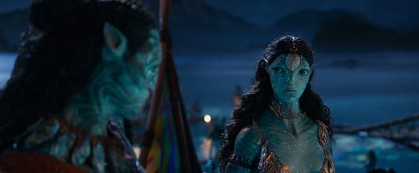 A still from 'Avatar: Fire and Ash' featuring the characters Konowari, played by Cliff Curtis, and Ronal, played by Kate Winslet, in a nighttime scene with a mystical atmosphere.