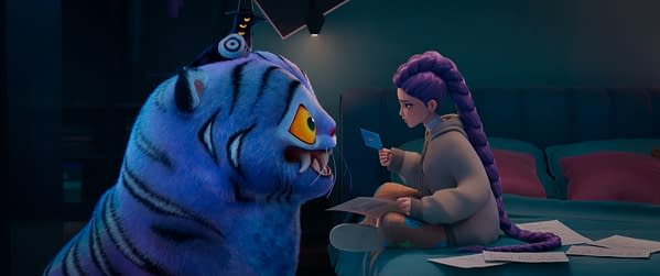 A vibrant scene from 'KPop Demon Hunters' featuring a large, animated blue tiger with expressive eyes talking to Rumi, a character voiced by Arden Cho, who is sitting on a bed surrounded by paper notes. The room has a modern aesthetic with soft lighting.