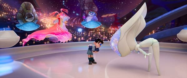 An animated scene from 'Elio' featuring a young boy interacting with a large, friendly alien creature in a colorful, futuristic environment. Surrounding them are whimsical alien characters, showcasing the imaginative world of Disney/Pixar.