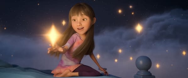 An animated illustration of a young girl with long brown hair, sitting on a bed in a dreamy landscape filled with stars. She joyfully reaches out with one hand towards glowing star-like sparks, embodying the whimsical adventure theme of the movie 'In Your Dreams'.