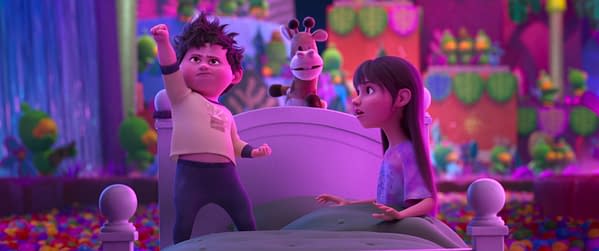 In Your Dreams. A colorful animated scene from 'In Your Dreams,' featuring a determined young boy raising his fist in triumph while his surprised sister looks on. They are surrounded by a whimsical dream landscape filled with vibrant colors and playful characters.