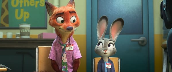 A cartoon scene from "Zootopia 2" featuring Nick Wilde, a fox with orange fur wearing a pink floral shirt and a name tag, sitting beside Judy Hopps, a gray rabbit with long ears wearing a blue shirt and a name tag. The background includes a colorful sign and various cups.