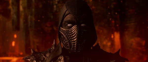 A character from Mortal Kombat II, wearing a dark, textured mask with a hood, stands against a backdrop of fiery colors, suggesting an intense atmosphere.