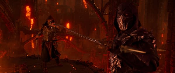 A dramatic battle scene from Mortal Kombat II, featuring two warriors in a fiery landscape. One character is wielding a chain weapon, while the other prepares for an attack, surrounded by glowing lava and dark structures.