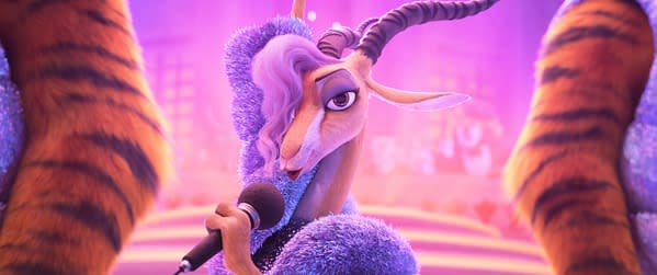 A cartoon gazelle, dressed in a sparkling blue outfit, holds a microphone while performing. The background features vibrant purple hues and blurred out figures, reminiscent of a lively stage environment from Disney's "Zootopia 2".