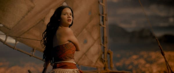 MOANA Catherine Laga'aia portrays Moana in Disney's live-action adaptation, featuring her looking out to sea from a boat with a sail at sunset.