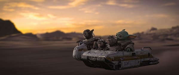 In this illustration from 'The Mandalorian and Grogu,' Grogu and a group of Anzellans are riding together in a futuristic vehicle against a scenic desert sunset backdrop.