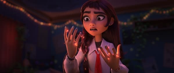 Billie from Disney's Hexed stares in surprise at glowing sparks around her hands in a dimly lit room.