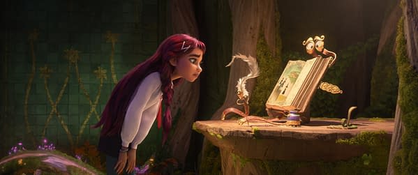 Billie from Disney's Hexed leans in to inspect a magical open book on a forest table, with a tiny owl-like creature perched on top.