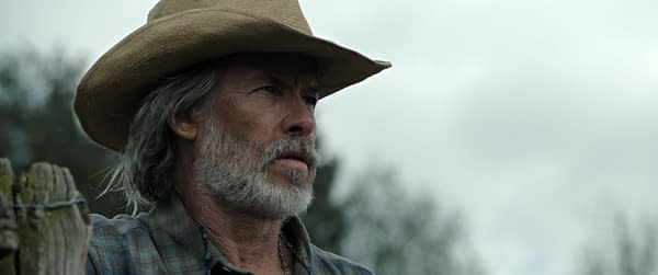 Guy Pearce as Pa wears a wide-brimmed cowboy hat in a close-up from The Dog Stars.
