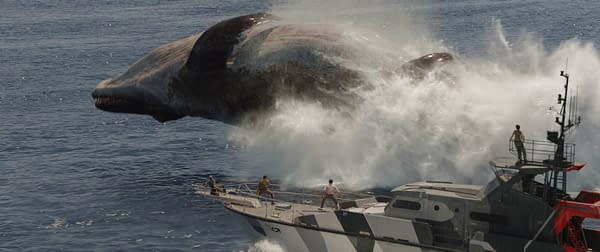 A dramatic scene from 'Jurassic World Rebirth' featuring a Mosasaurus breaching the surface of the ocean near a research vessel, with crew members reacting in surprise.