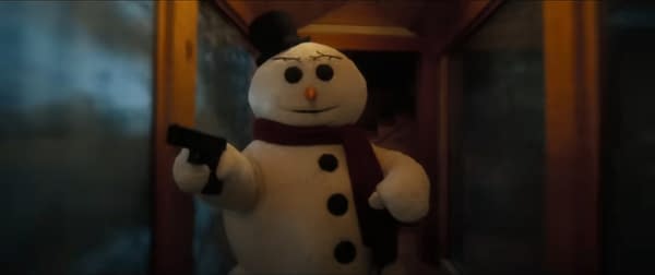 A snowman character, holding a handgun and wearing a black top hat and red scarf, stands in a dimly lit hallway. This scene is likely from a comedic or satirical context, reflecting a blend of humor and absurdity.