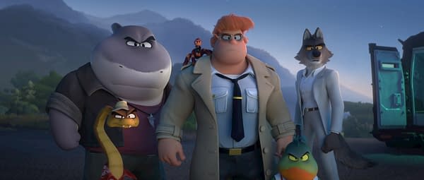 An illustration from 'The Bad Guys 2' featuring a group of animated characters: Mr. Snake, Mr. Shark, Chief Misty Luggins, Mr. Piranha, and Mr. Wolf, posed together against a scenic backdrop.
