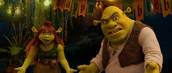 Shrek and Felicia stand under festive banners, both looking frustrated or confused in a scene from DreamWorks Animation's Shrek 5.