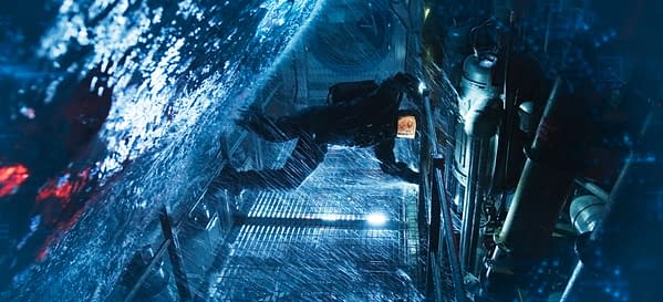 A dramatic scene from 'Mission: Impossible - The Final Reckoning' featuring a character submerged in water, navigating a futuristic environment filled with machinery and dimly lit elements.