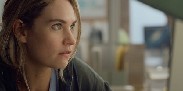 Close-up shot of Lily James portraying Whitney Wolfe Herd in the film 'Swiped', with a focused expression in an office setting.
