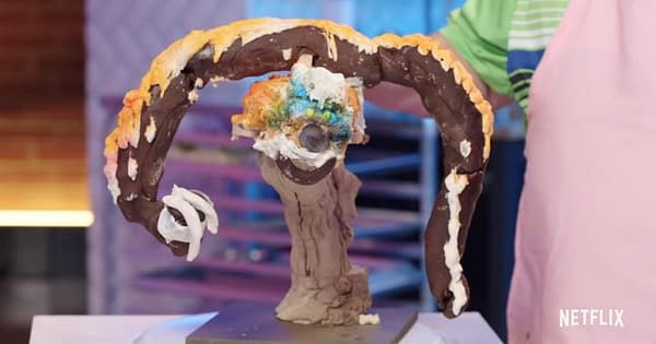 One of the competitors on Nailed It reveals their far from perfect cake, courtesy of Netflix.