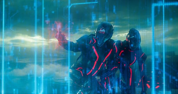 A scene from Disney's TRON: ARES featuring two characters in futuristic, dark suits with glowing red accents, amidst a digital backdrop of blue lines and abstract visual elements.