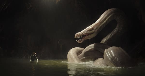 A scene from 'The Mandalorian' featuring a character resembling a lone figure wading in water, facing a large, serpentine creature known as a Dragonsnake, set in a dark, cave-like environment. The atmosphere is mysterious and tense, typical of the series.