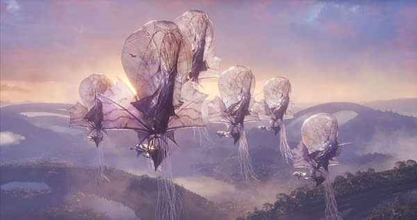 A scene from 'Avatar: Fire and Ash' featuring ethereal floating creatures with large, translucent wings, soaring above a lush, mountainous landscape at sunset. The image captures a vibrant atmosphere with soft colors in the sky and mist rising from the terrain.