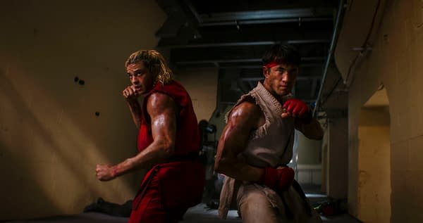 Noah Centineo and Andrew Koji stand back-to-back in fighting stances in a gritty Street Fighter action scene.