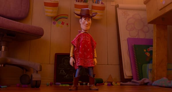 Woody stands in a child's bedroom wearing a red bandana bib and cowboy hat in a scene from Toy Story 5.