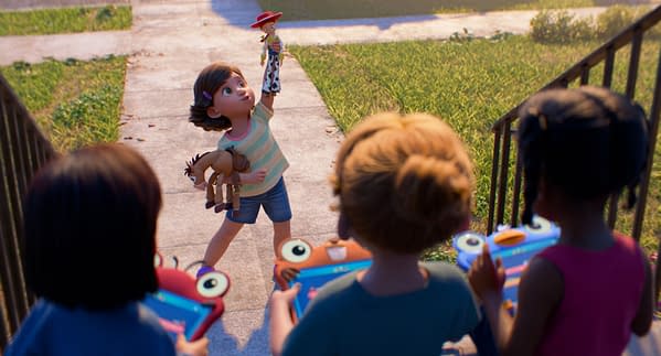 Bonnie stands on a sidewalk holding Woody up high in a scene from Disney and Pixar's Toy Story 5, while other children watch nearby.