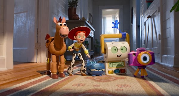 Jessie and Bullseye stand with new Toy Story 5 characters Smarty Pants, Atlas, and Snappy in a bright hallway. The animated group appears cheerful and ready for an adventure.