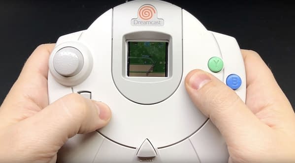 A man holding a Sega Dreamcast controller, courtesy of SEGA.