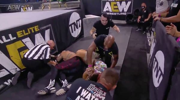 Rey Fenix hits a brutal dive on the floor... literally... on AEW Dynamite
